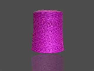 Pink bobbin of thread