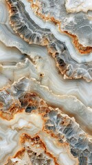 Obraz premium Beautiful abstract patterns of agate stone with shades of grey and hints of orange, perfect for backgrounds or textures.