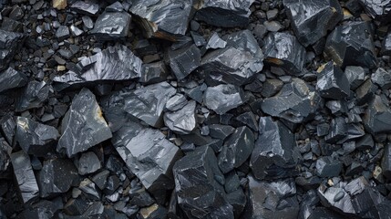 Close-up of dark, textured slate rock formations, showcasing natural patterns and colors in a striking geological composition.