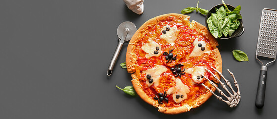 Tasty pizza for Halloween celebration on black background