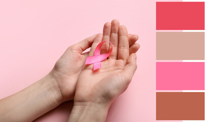 Female hands with pink ribbon on color background, closeup. Breast cancer awareness concept