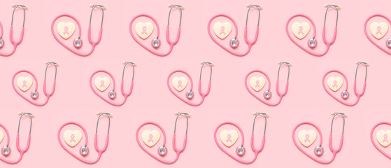 Heart shaped cookie with ribbon and pink stethoscope on color background. Breast cancer awareness concept