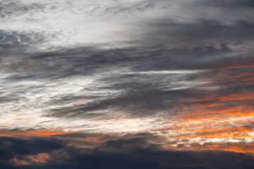Sky and clouds dramatic background with orange colors