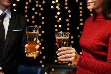 food and drink male friends are happy drinking beer and clinking glasses at a bar or pub.