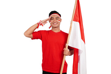 Indonesian man celebrating Indonesia's independence day on 17 August by holding the Indonesian flag...