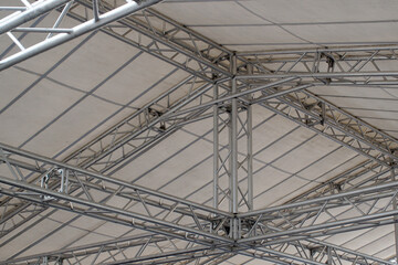 Inside view of part of the roof frame assembled from square aluminum trusses.