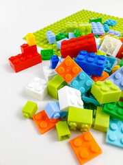 Various colored toy blocks on a white background. Educational toys for children