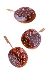 Tsukune, Japanese Chicken Meatball in teriyaki sauce with sesame seeds sprinkles on a white isolated background