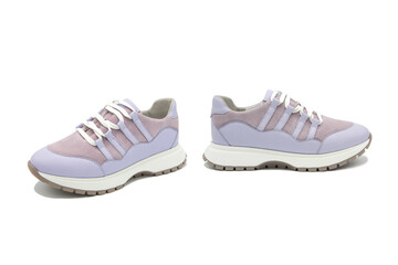 Sneakers. Pair of fashionable leather with suede inserts shoes isolated on white background.	