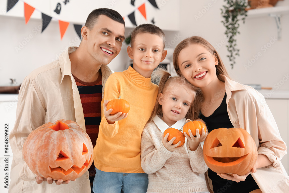 Wall mural happy family with halloween pumpkins in kitchen