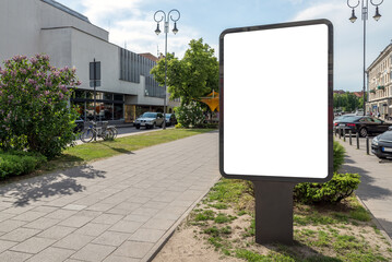 Blank Outdoor Billboard Mockup In City Alley. An Empty Poster Stand Illuminated By The Sun