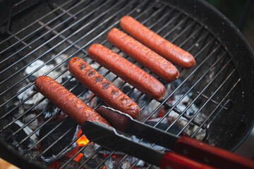 hot dogs on grill