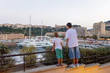 Happy child, visiting Monaco during summer, enjoying sunny days in Monte Carlo