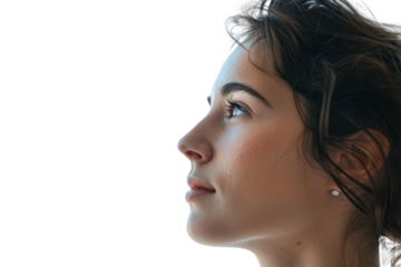 A young woman with a warm smile and bright eyes, her hair blowing in the wind, isolated on a white background.