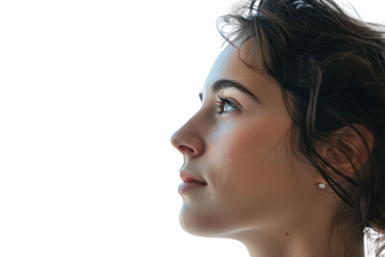 A young woman with a warm smile and bright eyes, her hair blowing in the wind, isolated on a white background. - Powered by Adobe