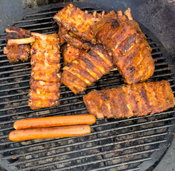 Barbecue meat is fried on a metal grate