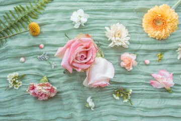 Elegant floral arrangement with pastel roses and ferns in a vase