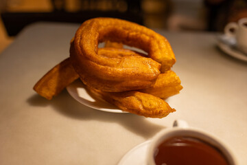 Close-up of chocolate with churros, a traditional breakfast of Spanish gastronomy