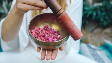 woman holding a tibetan singing bowl