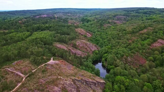 Val Sans Retour, Paimpont, Broceliande forest, Brittany in France. Aerial drone forward