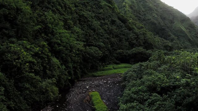 Teahupoo, Tahiti aerial drone view of the river in the valley of mountain Orohena Aorai Ronui. French Polynesia. 2024 Paris Olympics. Paradise in Pacific Ocean. Moana Disney inspiration Te Fiti.