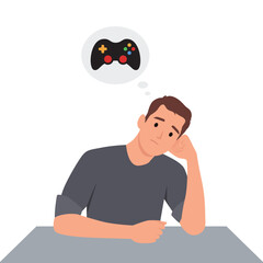 Young sad man thinking about video games.