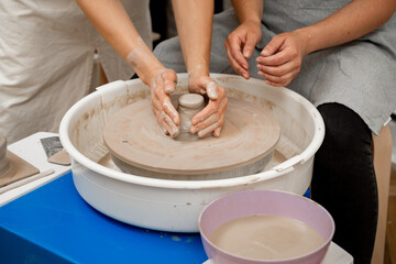 Ceramics workshop. Modeling a shape of your own clay project. Improving skills in traditional pottery. Learning how to create a bowl using a pottery wheel.