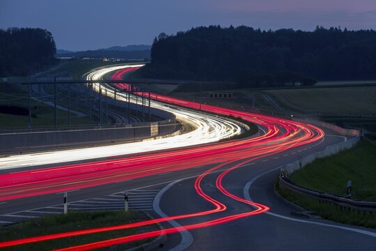 Tracers on the A8 motorway, winding road, evening, long exposure, Swabian Alb, Baden-W&uuml;rttemberg, Germany, Europe