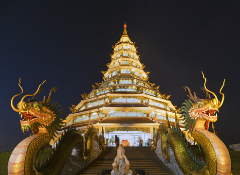 Nine-storey Chinese pagoda at dusk, dragons at the entrance to Wat Huay Pla Kang Temple, Kuan Yin, Chiang Rai, Northern Thailand, Thailand, Asia