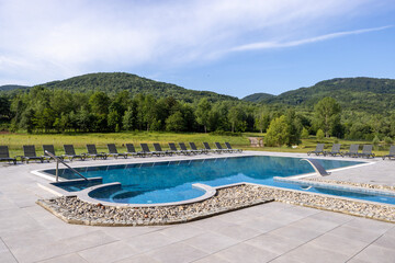 Outdoor hotel swimming pool in the summer