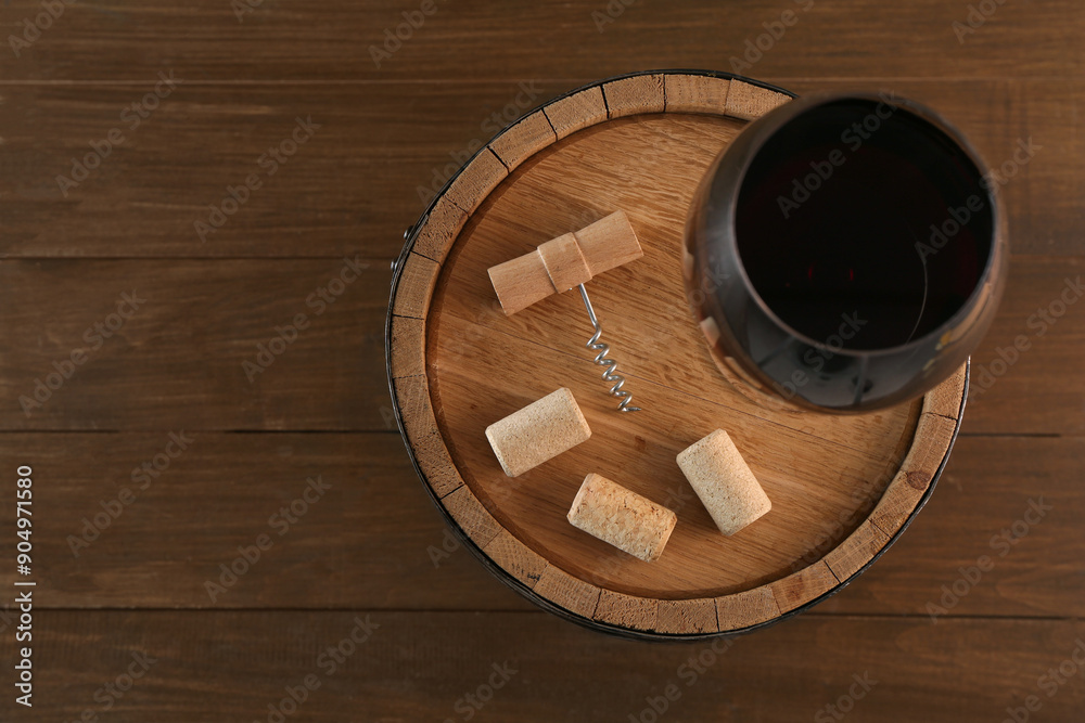 Sticker Corkscrew, corks, glass of wine and barrel on wooden, top view. Space for text