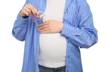 Expecting twins. Pregnant woman holding two pacifiers on white background, closeup