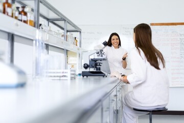 Scientists discussing research in a modern laboratory.