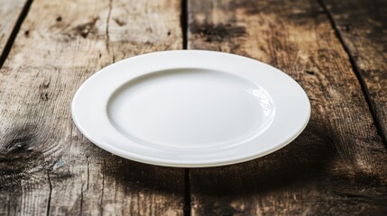 A clean white plate on a rustic wooden table, leaving ample copy space for text.