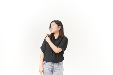 Young Asian woman presenting and pointing side copyspace wearing Black t-shirt and jeans isolated on white background