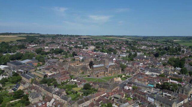 Sherborne, Dorset, England: DRONE VIEWS: The drone circles the centre of Sherborne and Sherborne Abbey. Sherborne is an affluent market town and popular UK tourist destination (Clip 2).