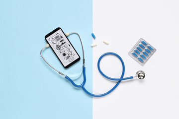 Mobile phone with stethoscope and pills on color background. Telemedicine concept
