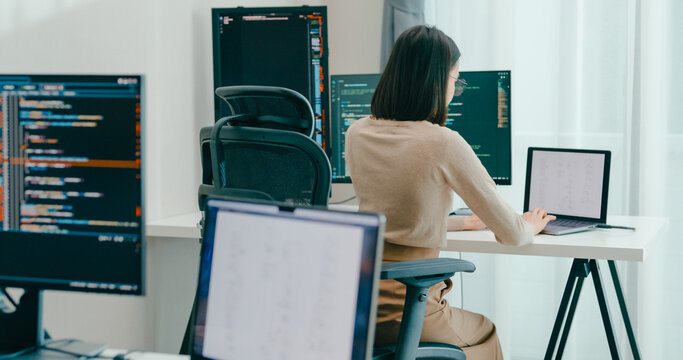 Group Adult Asia male, female freelance typing write prompt AI bot IT app smart program nomad, video game, terminal with coding language, user interface, designer, big data center on desktop computer.