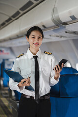 female pilot on airplane Asian woman in flight simulator. © NINENII