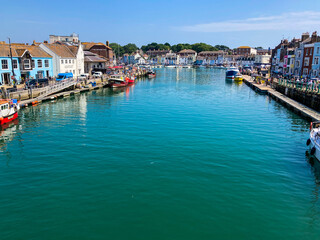 Fototapeta premium Boats moored along Weymouth Harbour, England, UK