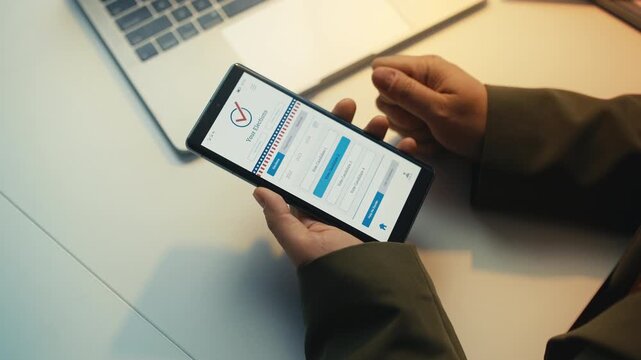 Woman using online voting application on mobile phone, choosing a candidate