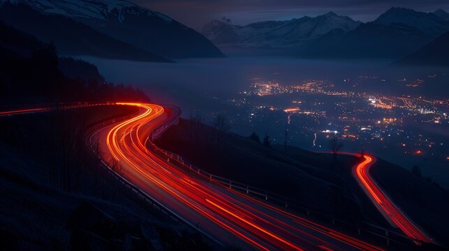 A long exposure shot of a highway in the mountains at night
