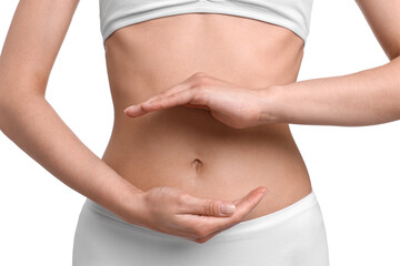 Healthy digestion. Woman holding something near her belly on white background, closeup