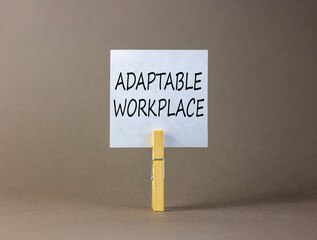 Adaptable workplace symbol. Concept words Adaptable workplace on beautiful white paper on wooden...