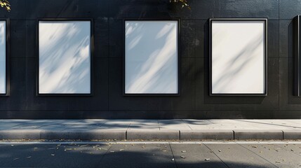 Thee empty advertising billboards on the wall of building
