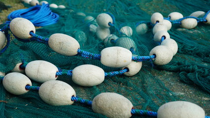 white buoy on fishing net