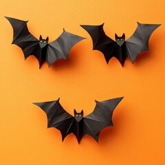 Fototapeta premium Spooky Halloween Bat Decorations on Orange