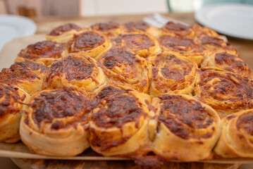 Vegetarian yeast dough pastry shaped in snails with tomato sauce and cheese