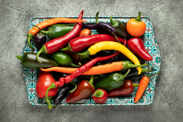 Mix of hot cayenne, jalapeno and buena mulata peppers. Top view.