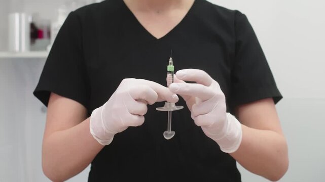 
A female cosmetologist in gloves is preparing to perform a procedure on a young client in a modern dermatology clinic, highlighting professional skincare services.